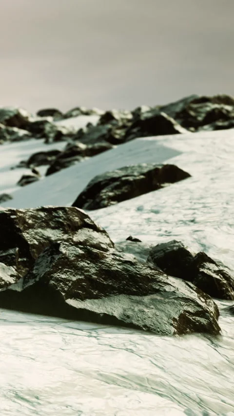 Snow covered rocks in a remote area at sunset during winter Stock Footage 346754064