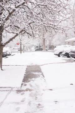 Snow covered sidewalk Stock Photos