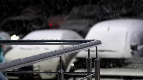A snow-covered, silver-colored chrome-plated railing Stock Footage 226562979