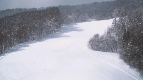 Snow Covered Ski Resort Slope and Winter Mountain Forest Stock Footage 341748906
