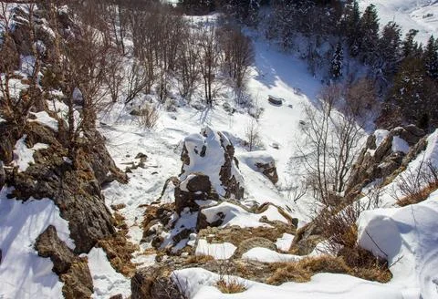 Snow-covered slopes of a mountain range, winter time in a nature park Stock Photos