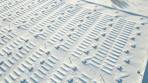 Snow Covered Solar Panel Rooftop With Geometric Patterns in Winter Sun Stock Footage 328518598