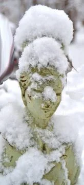 Snow covered statue Stock Photos