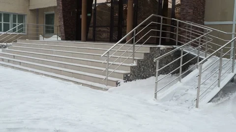 Snow-covered steps and a ramp at the entrance to the building . Siberia. Stock-Footage 272279646