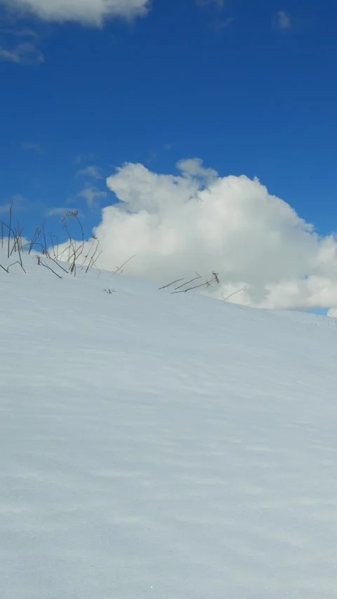 Snow-covered summit view from Hfats with soft winter light over the rugged Ba Stock Footage 308295941