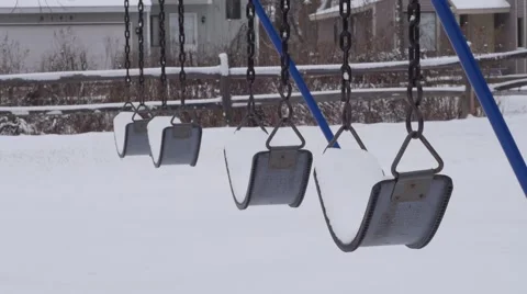 Snow Covered Swings Stock Footage
