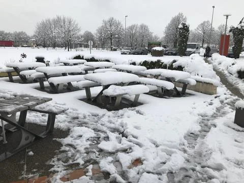 Snow covered tables Stock Photos