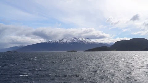 Snow covered tops on a mountain range seen from a ship Stock Footage 109509034