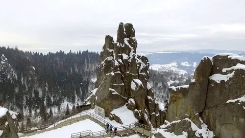 Snow covered trees cliffs and rocks in the mountains Stock Footage 129421952