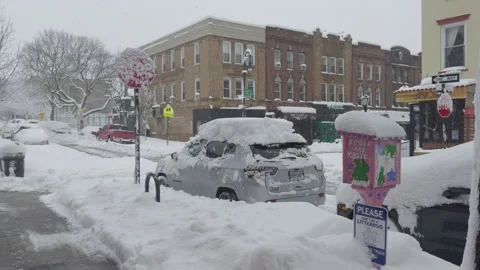 Snow-Covered Vehicles at Brooklyn Intersection, City Halted, Blizzard 動画素材 329888761
