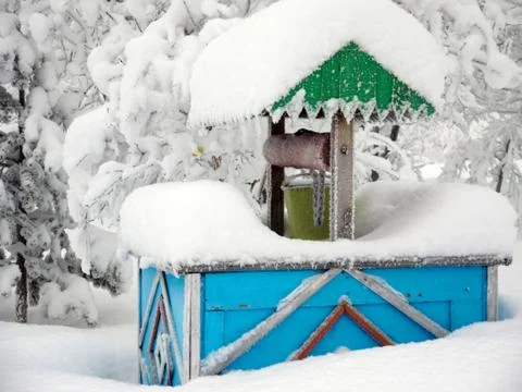 Snow-covered well Foto stock