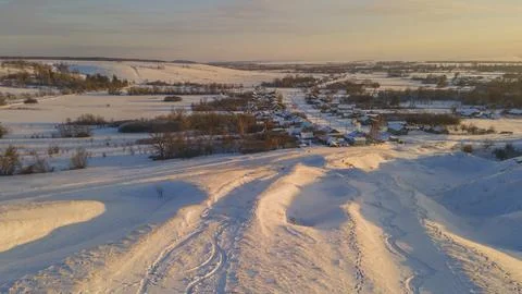 Snow-covered winter fields in the cold in the sun Stock Photos