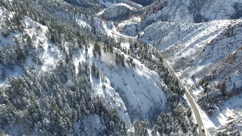 Snow covered winter forest and mountains 4k DRONE Stock Footage 100262796