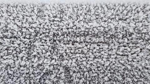 Snow covers the ground in a thick layer during a winter day in a cold region Stock Photos