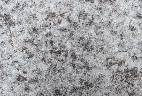 Snow covers a rustic surface in a winter landscape Stock Photos