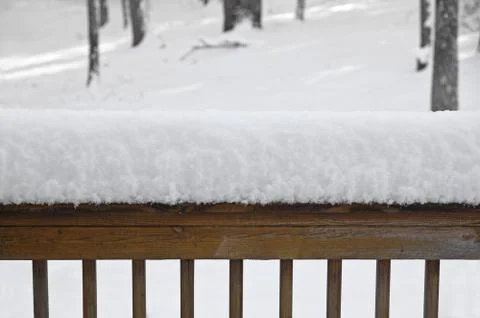 Snow on Deck Rail Stock Photos