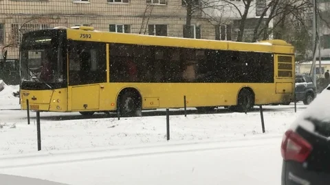 Snow disaster, bus having troubles with moving uphill Stock Footage 127061278