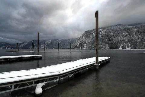 Snow on the dock by the lake. Stock Photos
