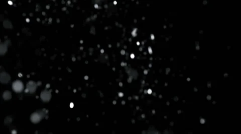 Snow drifting on black background Stock Footage 61671170