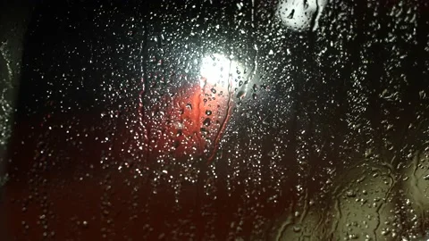 Snow drops on the window. Red and white lights on the background. Winter season Video stock 166447406