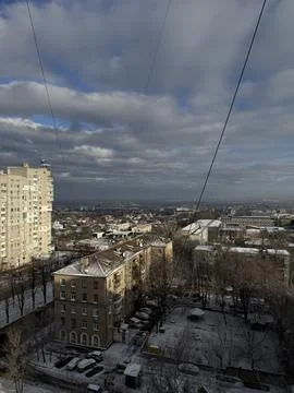 Snow-Dusted Rooftops Under Cloudy Sky Stock Photos