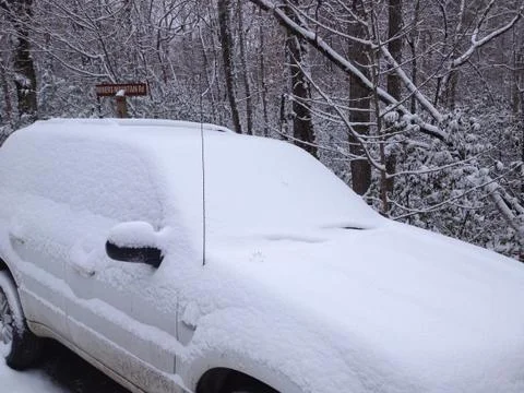 Snow engulfs SUV Stock Photos