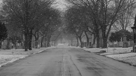 Snow fall on a cemetery road Stock Footage 64142156