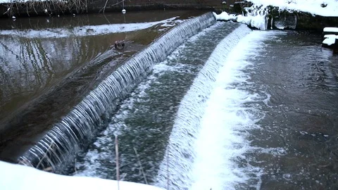 Snow Fall Small Stream waterfall Slow motion Pan out Stock Footage 90253687