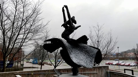 Snow Fall on Statue of a Dancing Female in Skirt Stock Footage 99532947