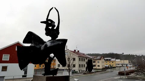Snow Fall on Statue of Dancing Female in Residential Area Stock Footage 99532961