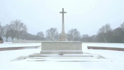 Snow fall on World War One battlefields : Hooge Crater Cemetery, Ypres, Belgium Stock Footage 101938122