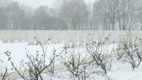 Snow fall on World War One battlefields : Hooge Crater Cemetery, Ypres, Belgium Stock Footage 102168143