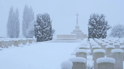 Snow fall on World War One battlefields : Tyne Cot Cemetery, Ypres, Belgium Stock Footage 102195244
