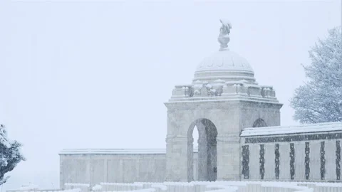 Snow fall on World War One battlefields : Tyne Cot Cemetery, Ypres, Belgium Stock Footage 102197313