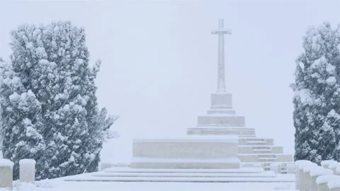 Snow fall on World War One battlefields : Tyne Cot Cemetery, Ypres, Belgium Stock Footage 102198150