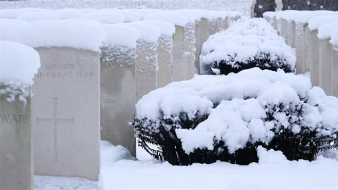 Snow fall on World War One battlefields : Tyne Cot Cemetery, Ypres, Belgium Stock Footage 102207990