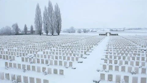Snow fall on World War One battlefields : Tyne Cot Cemetery, Ypres, Belgium Stock Footage 102208803