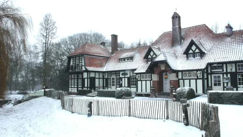 Snow fall on WWI battlefields : hotel near Hooge Crater Museum, Ypres, Belgium Stock Footage 102174142
