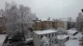 Snow fallen in Brunswick city backstreet courtyard over buildings and trees 4k or 4k+ Resolution
