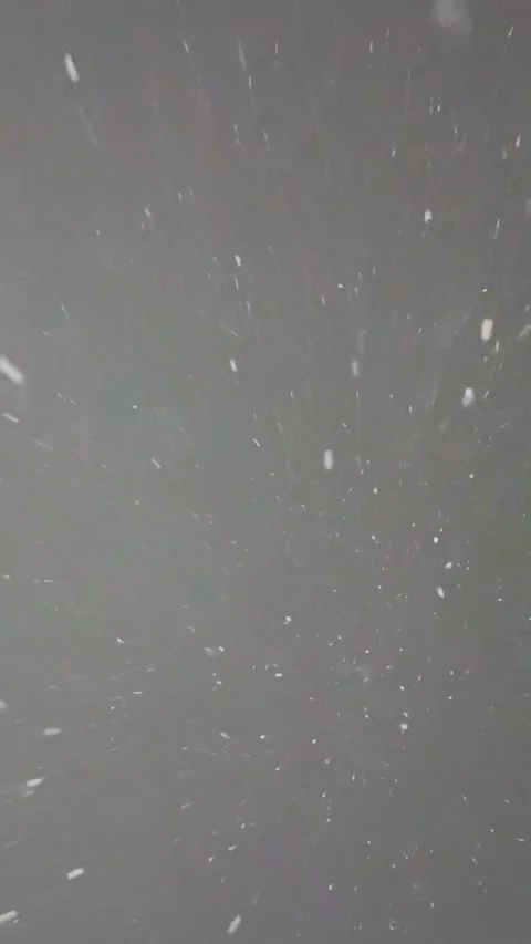Snow Falling from Above on Blue and White Sky Background Stock Footage 330167115