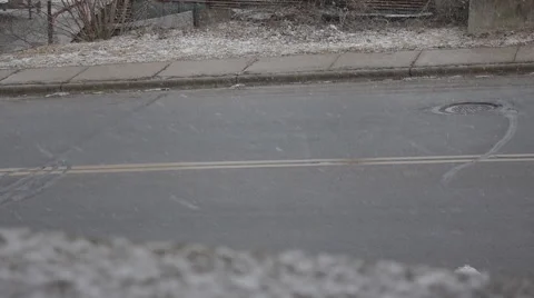 Snow falling against a road Stock Footage 48605937