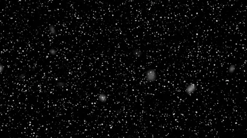 Snow falling animation on a black background, seamless loop Stock Footage 265175645