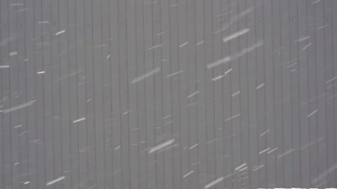 Snow is falling on the background of the fence Stock Footage 265008293