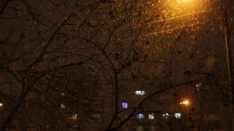 Snow falling on the background of street lamp of an apartment house in the city Stock Footage 131452775
