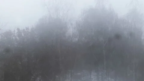 Snow falling behind a misted window in winter Stock Footage 223572478