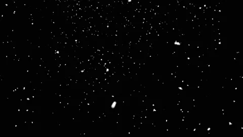 Snow falling on black background Stock Footage