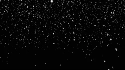 Snow falling on black background Stock Footage 143886361