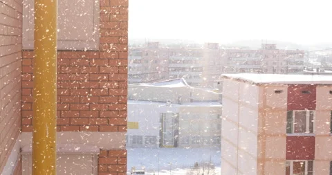 Snow is falling, blizzard against the background of residential buildings, close Stock Footage 148871374
