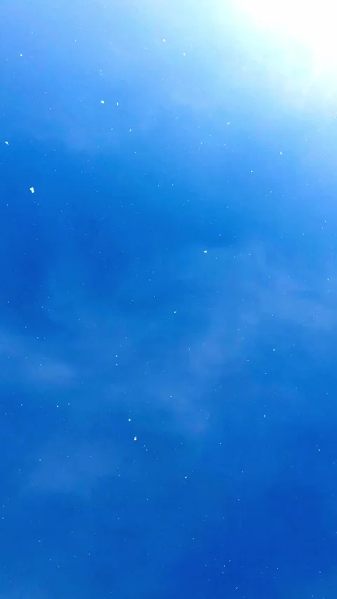 Snow is falling from the blue sky Stock Footage 146208260