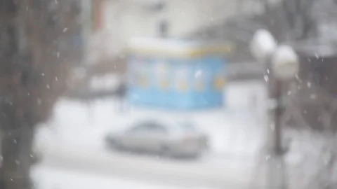 Snow falling on blurred background in city Stock Footage 71313364